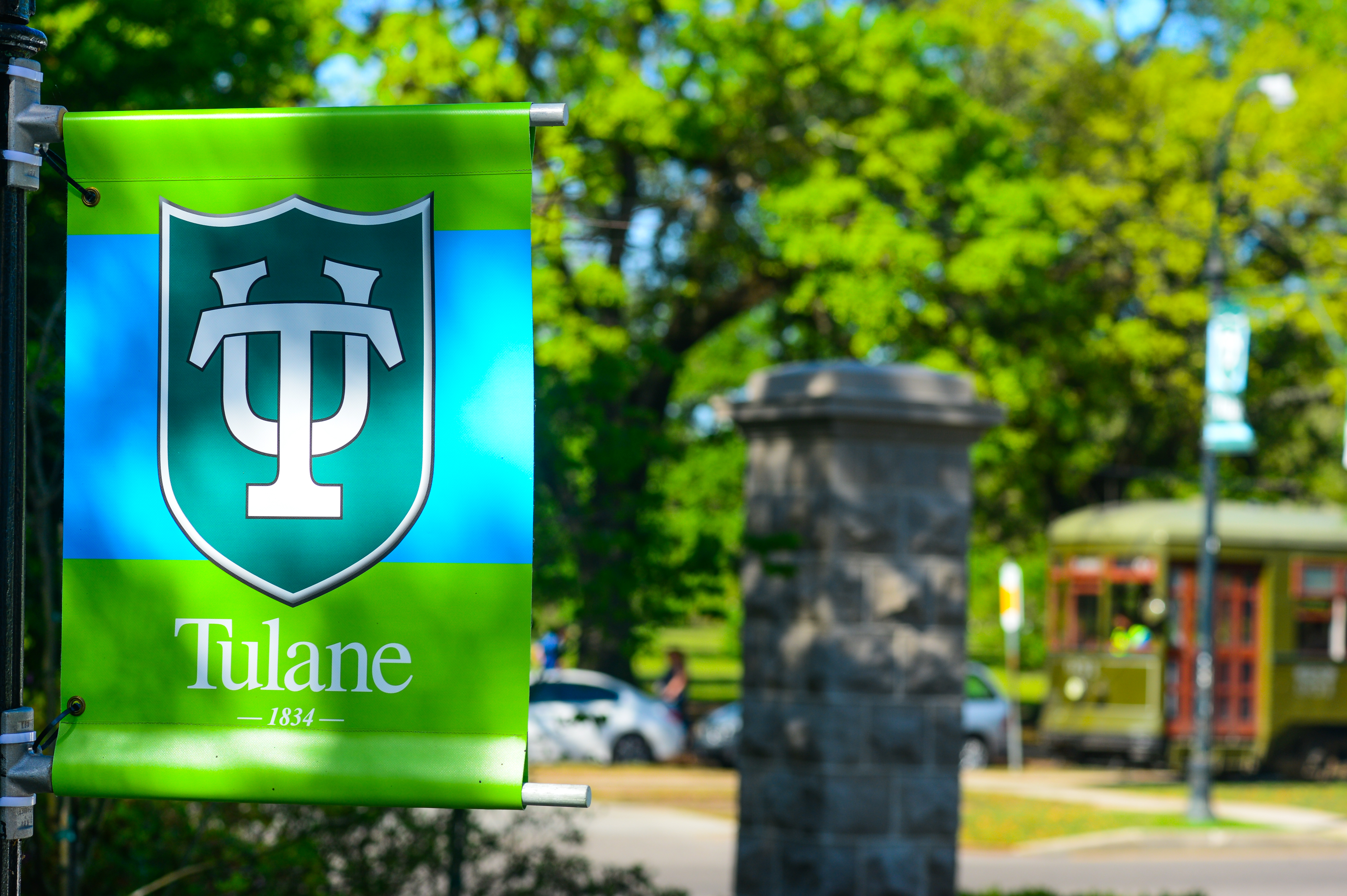 Tulane sign overlooking St. Charles Ave. and the streetcar line.